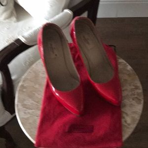 Red patent leather Valentino shoes.